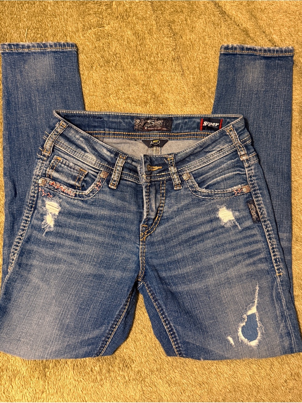 Distressed silver brand skinny jeans